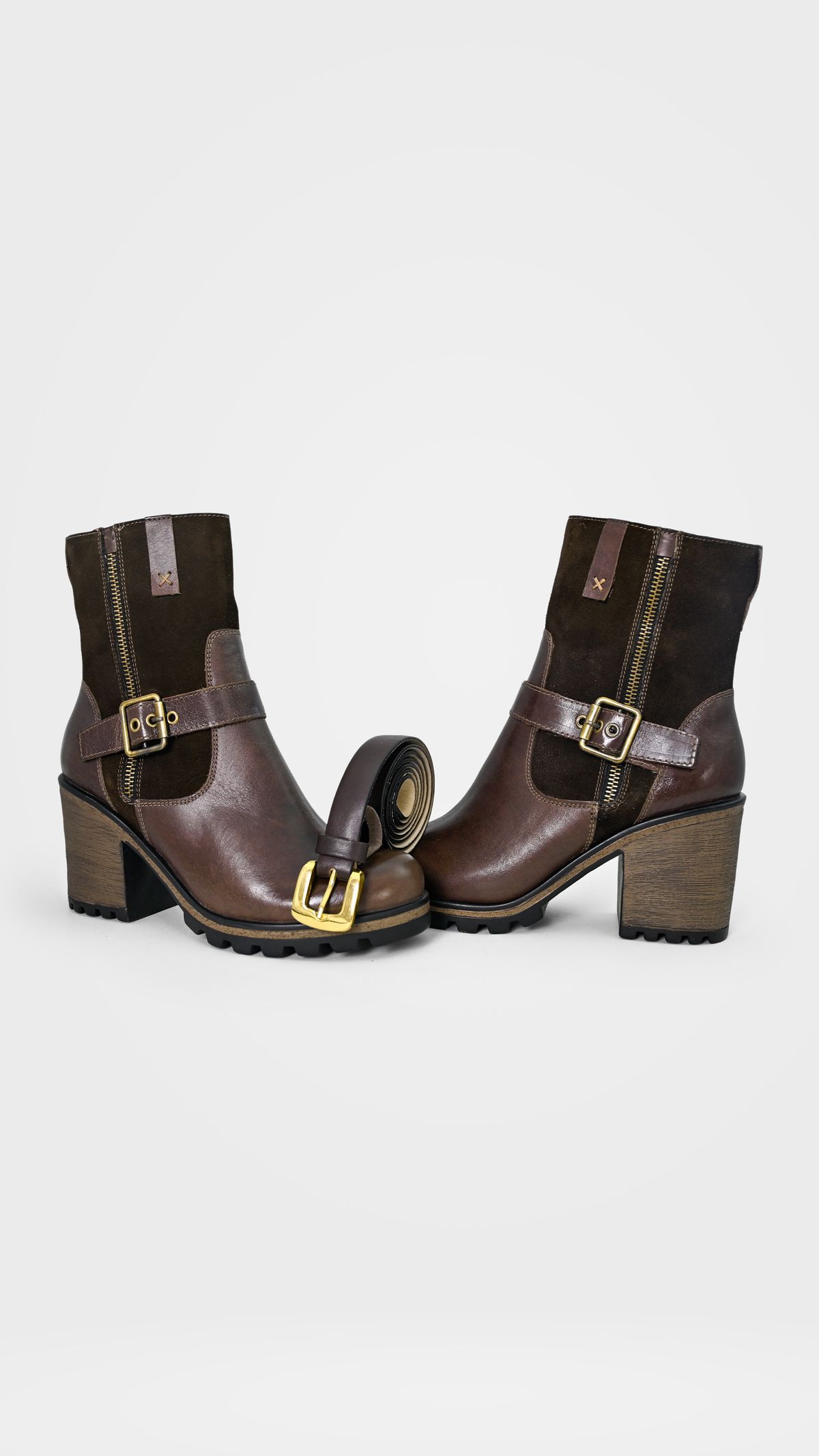 Brown leather ankle boots with a matching belt.